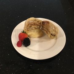 A picture of A Cinnamon Roll in a mug.