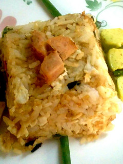 A picture of Sausage and egg fried rice.