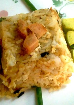 A picture of Sausage and egg fried rice.
