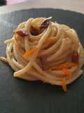 Pici in salsa di finocchio, acciughe e scorza di arancia