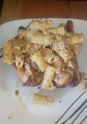 A picture of Cornish Hen with Cheesy Pasta.