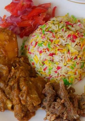 A picture of Colored Rice with Wet fried Beef.