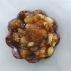 A picture of Gur dhana chocolate bitesWhen its engagement or wedding jaggery and coriander seeds are offered.
