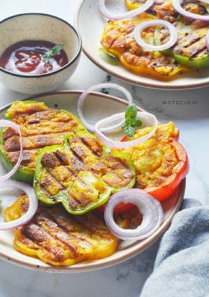 A picture of Cheesy potato stuffed Capsicums.