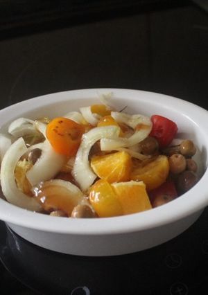 A picture of Salad with Arbequina Olives, Orange, and Cherry Tomatoes.