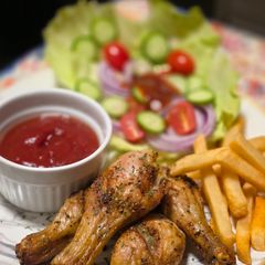 A picture of Oven-roasted chicken drumsticks.
