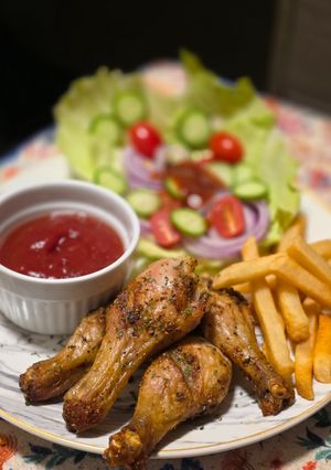 A picture of Oven-roasted chicken drumsticks.