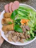Vietnamese Noodle Bowl with Crispy Spring Rolls and Stir-Fried Pork