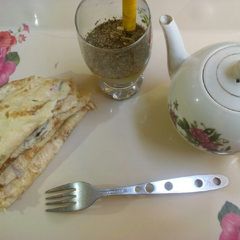 A picture of Egg omelette with lemongrass tea.