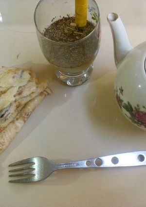 A picture of Egg omelette with lemongrass tea.