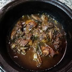 A picture of Black chicken curry.