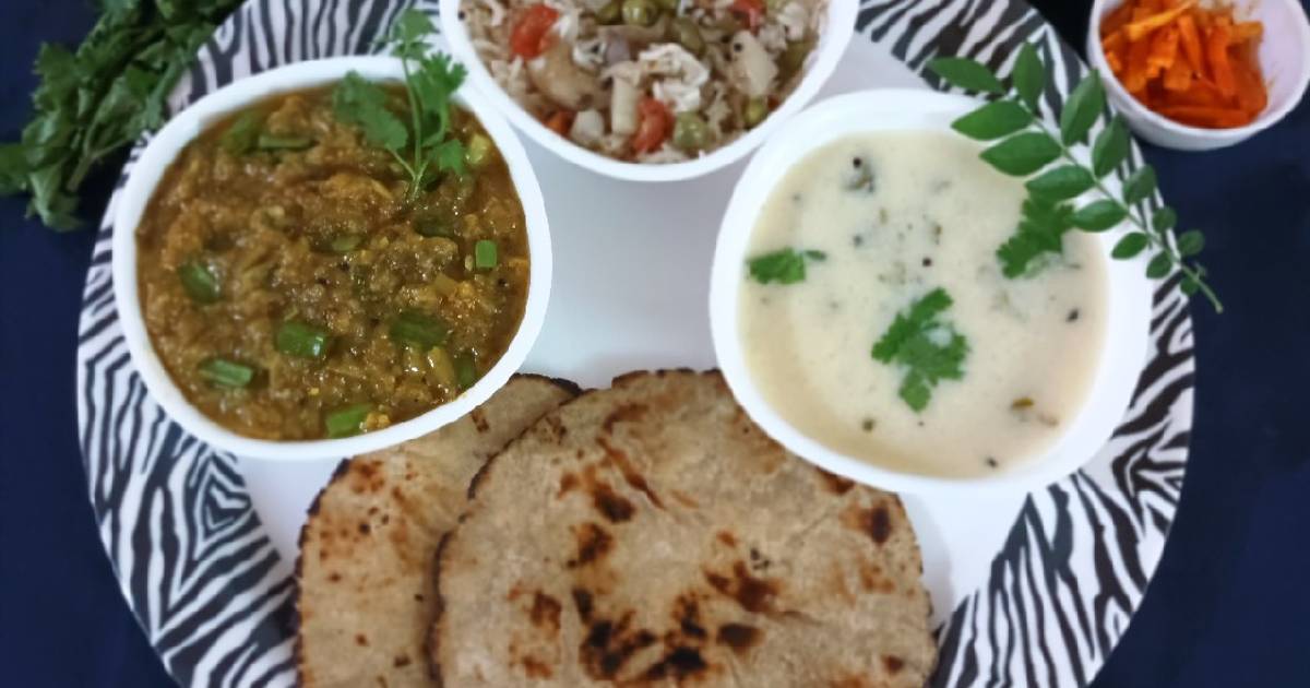 Gujarati thali Jowar rotla with baigan bharta, pulav and kadhi Recipe