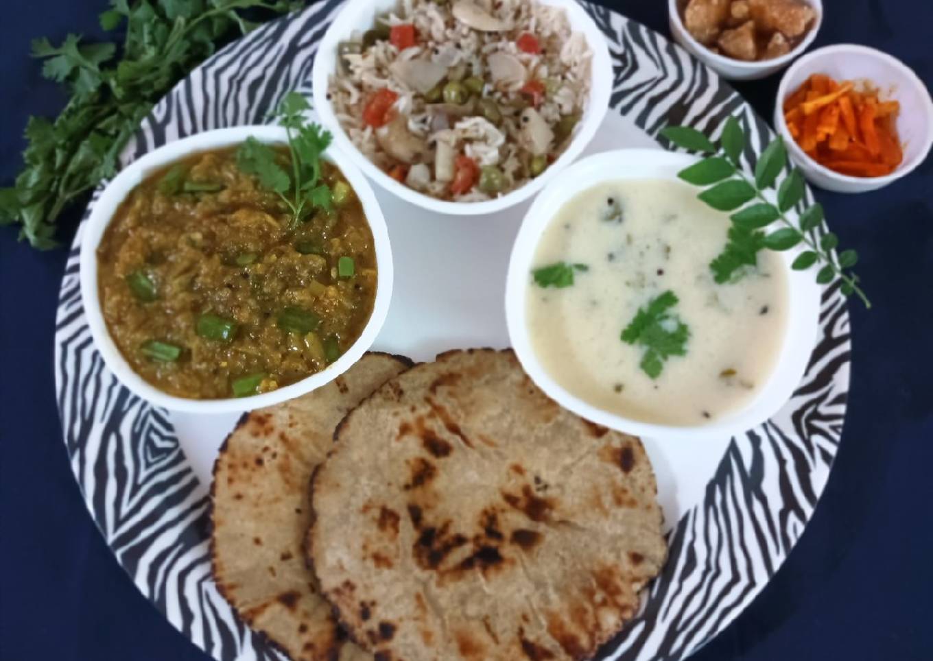 Gujarati thali: Jowar rotla with baigan bharta, pulav and kadhi