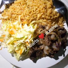 A picture of Fried rice with grilled liver and cabbage salad.