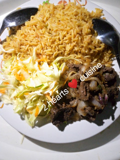 A picture of Fried rice with grilled liver and cabbage salad.