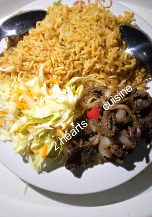 A picture of Fried rice with grilled liver and cabbage salad.