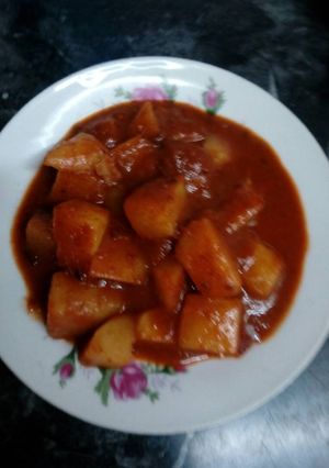 Una foto de Papas en salsa de pasilla