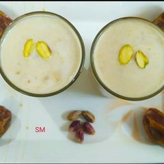 A picture of Dates Lassi with pistachios.
