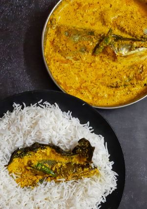 A picture of Pabda Paturi (with Taro/ kochu/Alvi leaves) and Pabda Bhappa.