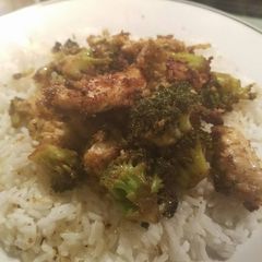 A picture of Chicken and broccoli with white rice.