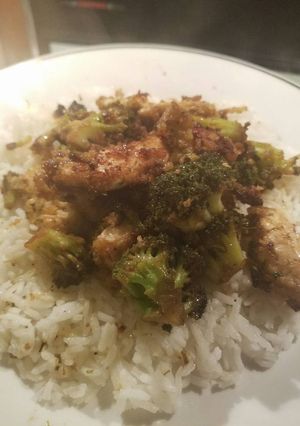 A picture of Chicken and broccoli with white rice.