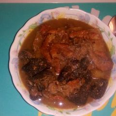 Assorted meat peppersoup with yam A picture of Assorted meat peppersoup with yam.