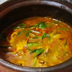 A picture of Fish curry in mud pot.