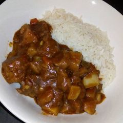 A picture of Rice and vegetable beef stew.