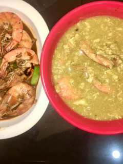 A picture of Broccoli egg drop soup with prawns.