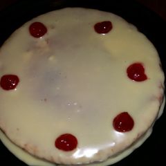 A picture of Butter cake with white chocolate ganache.