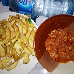 A picture of Egg sauce with fried potatoes.