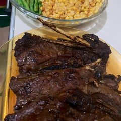 A picture of Grilled T-Bone Steak w/ Corn, Green Beans & Potato Wedges.