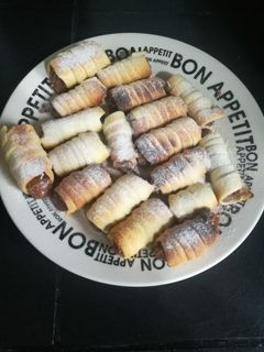 Una foto de Cañoncitos de dulce de leche
