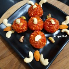 A picture of Gajar halwa ladoos with dry fruits.