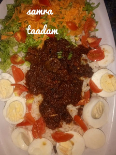 A picture of Rice and stew with veggies.