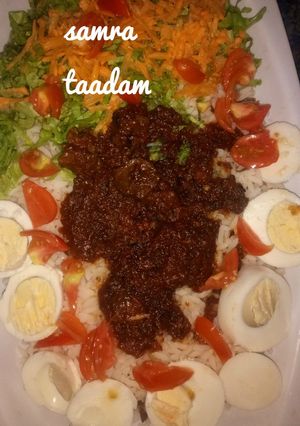 A picture of Rice and stew with veggies.