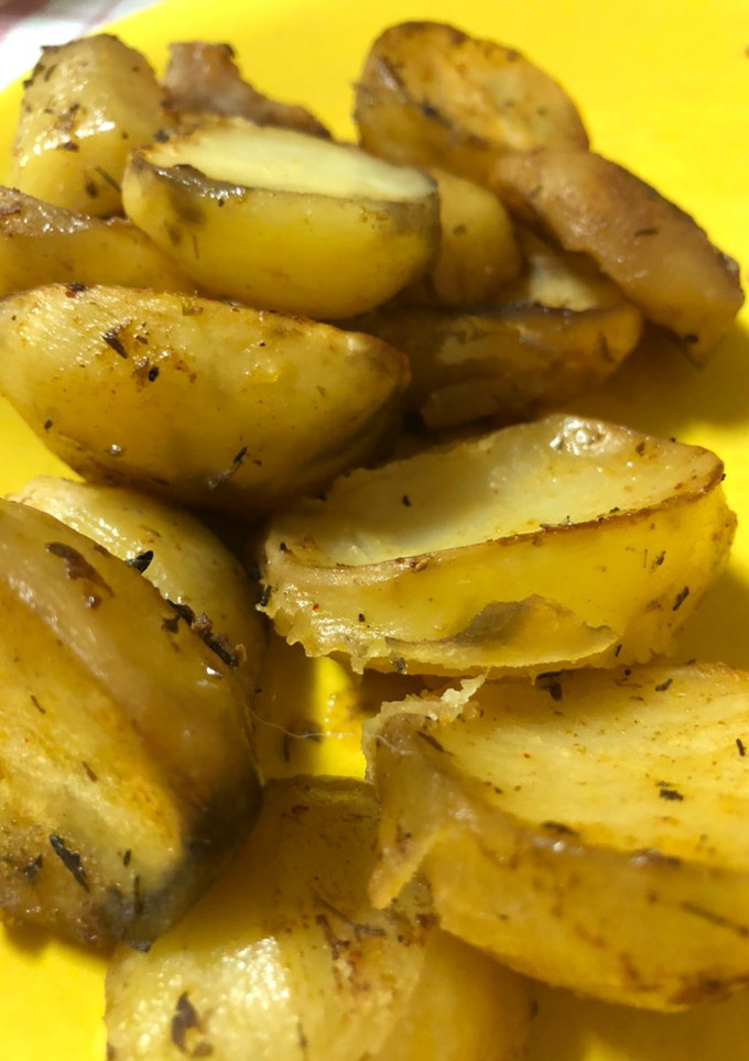 Una foto de Gajos de papas condimentadas al horno