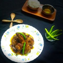 A picture of SHORSHE MURGI(CHICKEN in CURRIED MUSTARD SAUCE).