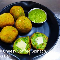 A picture of Crispy cheesy stuffed spinach khichu ball.