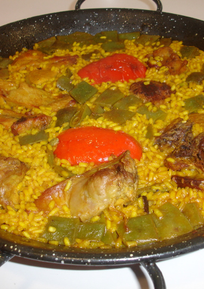 Una foto de Paella de conejo y magro