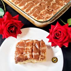 A picture of Tres Leches Cake With Chocolate Topping.
