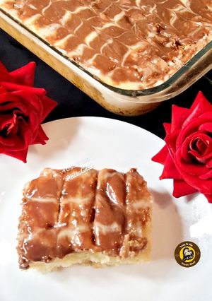 A picture of Tres Leches Cake With Chocolate Topping.