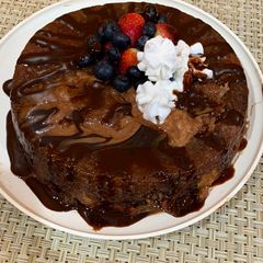 A picture of Banana cake with strawberries and blueberries😋.