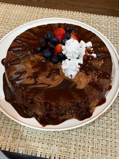 A picture of Banana cake with strawberries and blueberries😋.