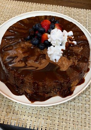 A picture of Banana cake with strawberries and blueberries😋.