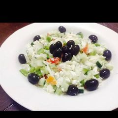 Feta cheese salad and black olives A picture of Feta cheese salad and black olives.