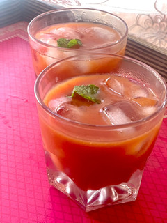 A picture of Mango cherry plum 🥭🍒🫐 mocktail.