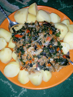 A picture of Boiled Irish potatoes with ugu sauce.