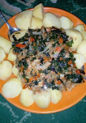 A picture of Boiled Irish potatoes with ugu sauce.