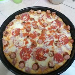 A picture of Choma sausage pizza.